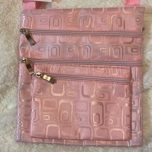 NWOT Pretty soft shiny pink cross body bag.